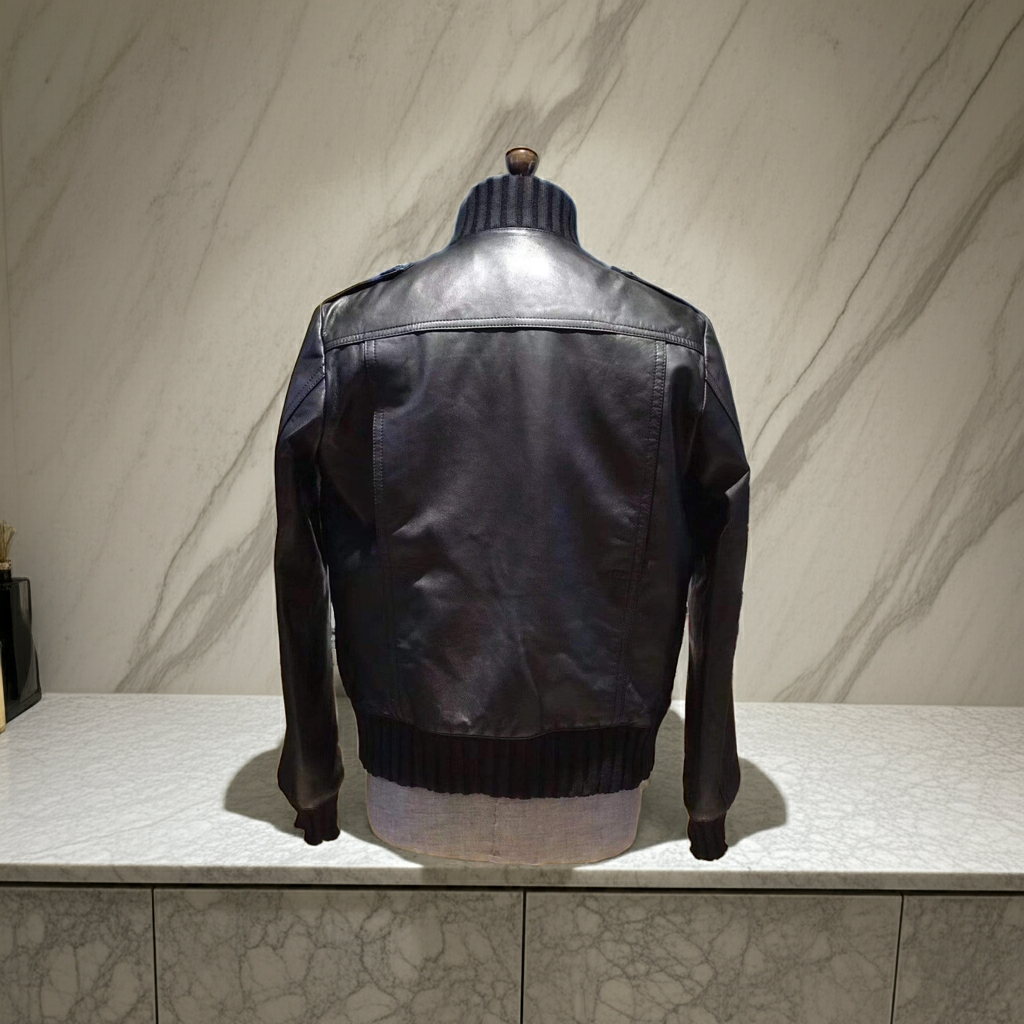 Black Leather Jacket Trimmed With The Classic Ribbed Jersey Cuffs, Collar